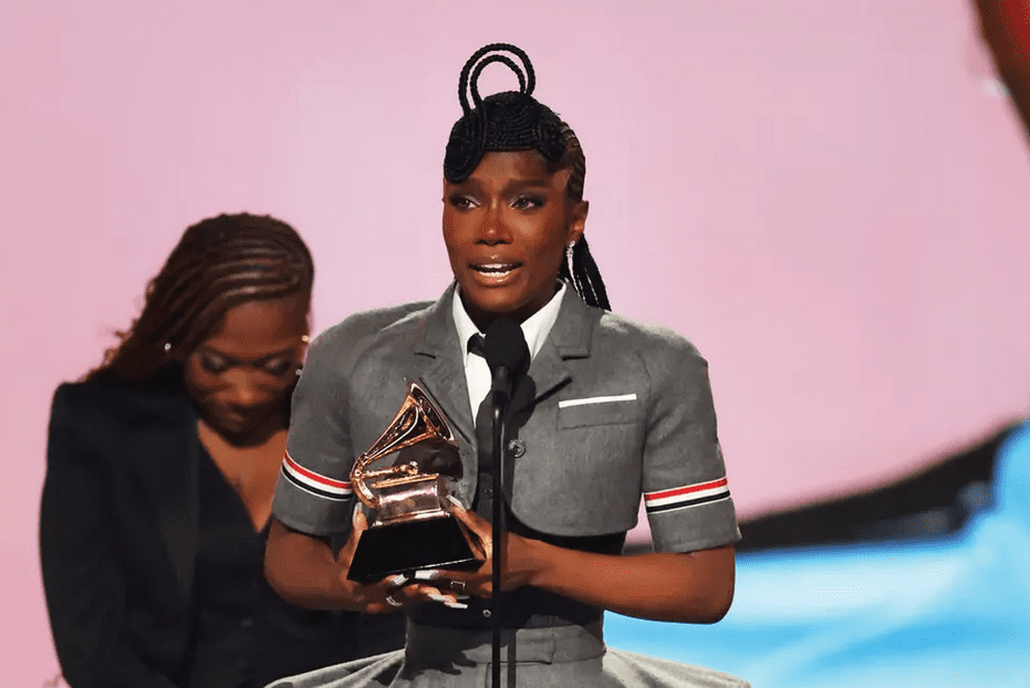 a woman holding a trophy