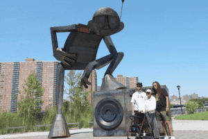 a group of people standing in front of a statue