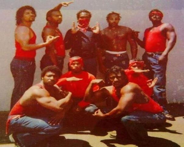 A group of men posing for a pictureDescription automatically generated with medium confidence