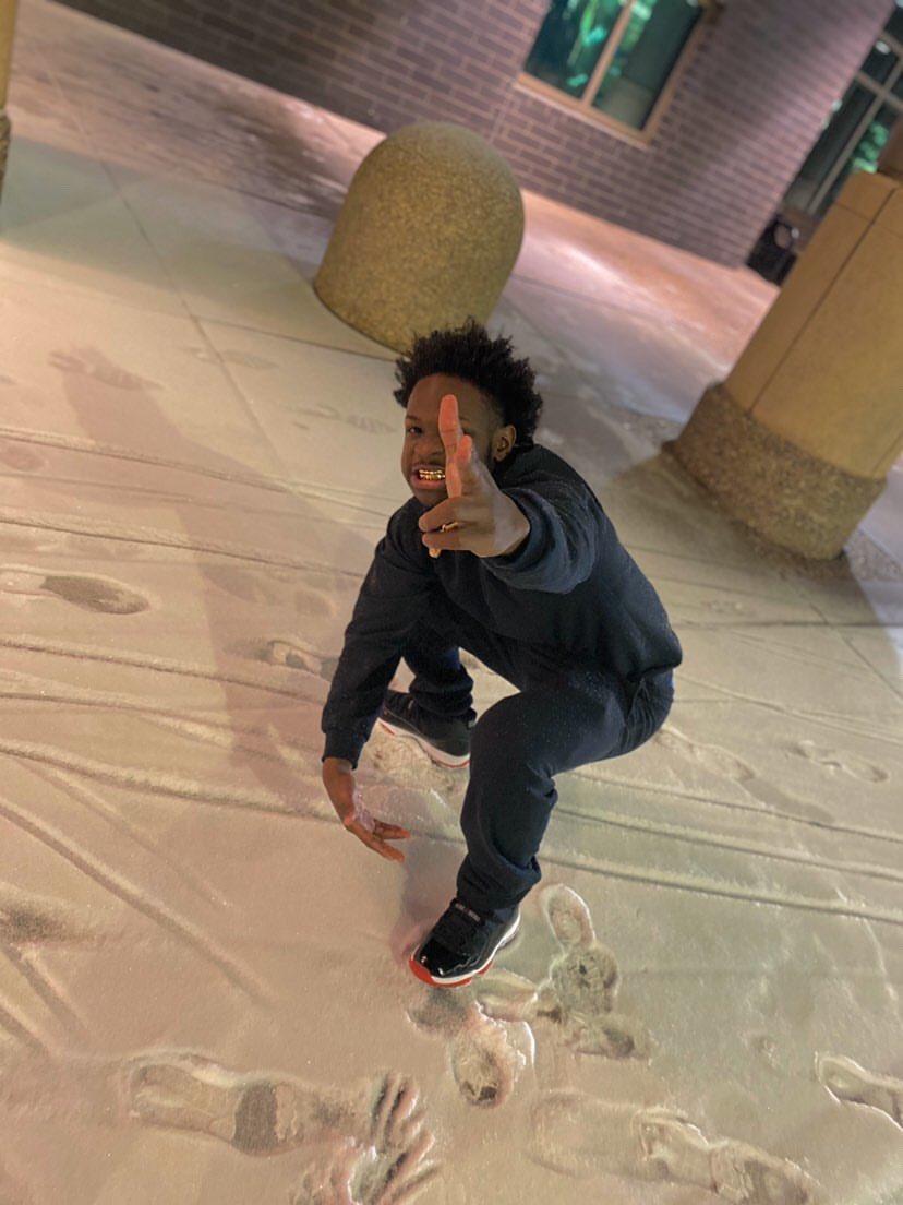 A person sitting on a skateboard

Description automatically generated with medium confidence