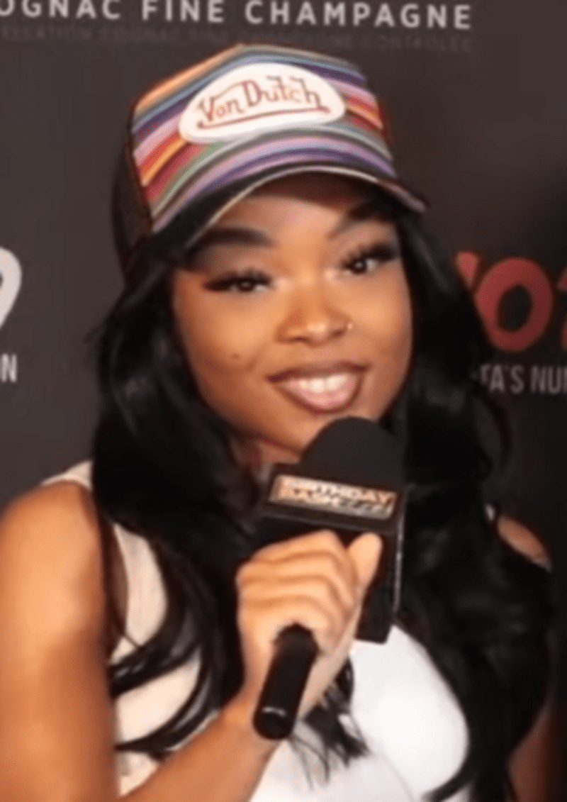 Lola Brooke being interviewed