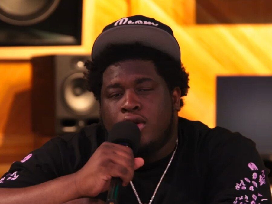 Cash Cobain speaking into a microphone