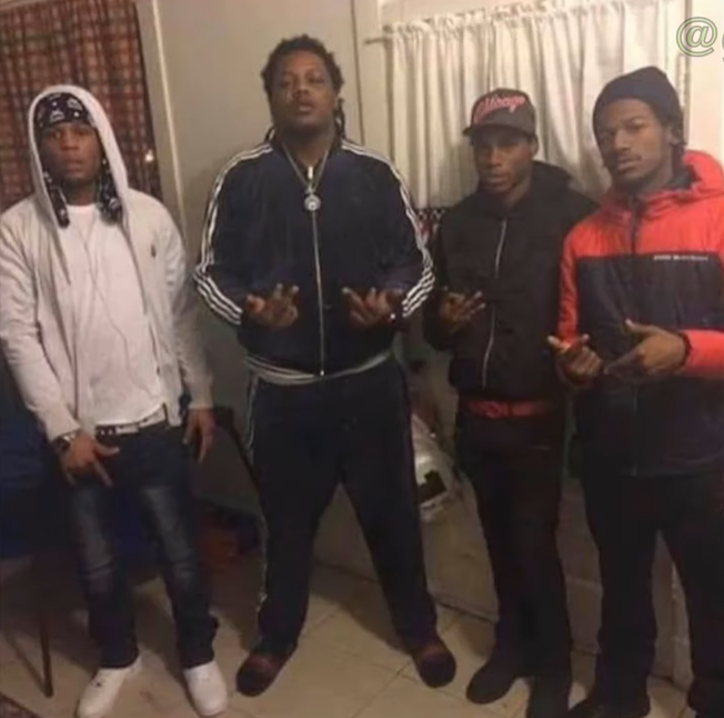The Legacy Of T.Roy: The Chiraq Rambo 69 A group of men posing for a photo
Description automatically generated with medium confidence