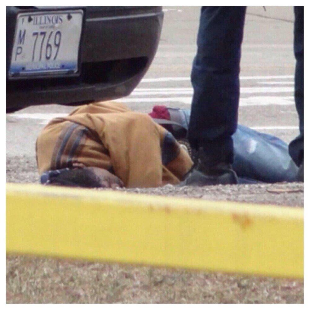 A person lying on the ground

Description automatically generated