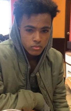 A person looking at the camera

Description automatically generated