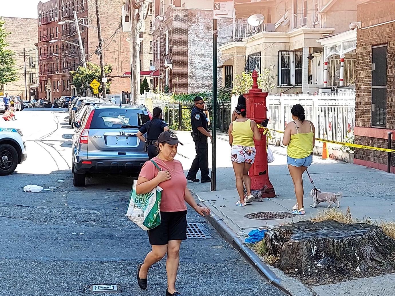 A group of people walking on a sidewalk

Description automatically generated with medium confidence