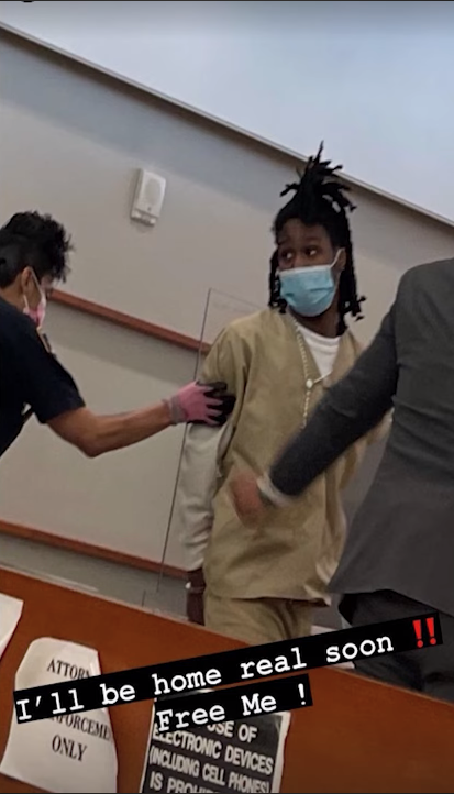 A person wearing a mask and scrubs

Description automatically generated with low confidence