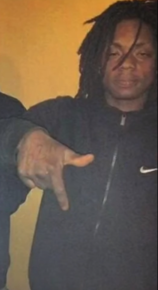 The Legacy Of T.Roy: The Chiraq Rambo 14 A picture containing text, indoor, wall, person
Description automatically generated