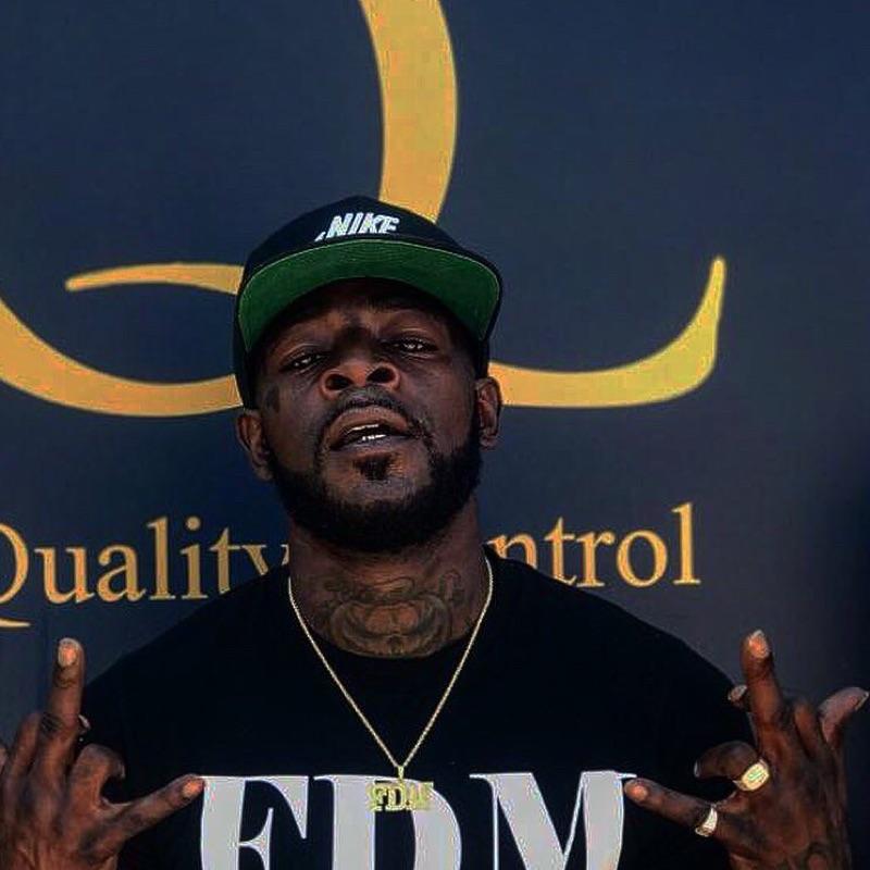 A person wearing a hat and holding his hands up

Description automatically generated with medium confidence