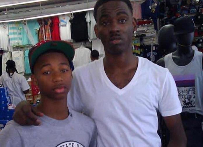 Key Glock: The Heir To The PRE Empire 12 A person and a child posing for the cameraDescription automatically generated with medium confidence