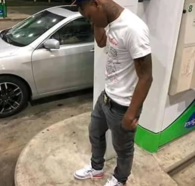 A person standing next to a carDescription automatically generated with medium confidence