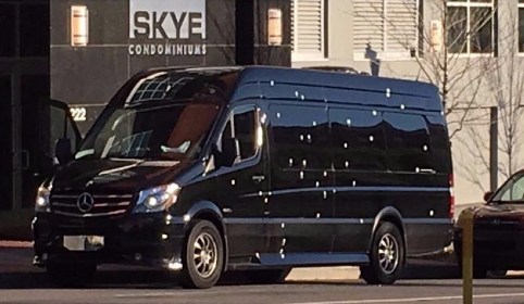 A black van parked on the side of a street

Description automatically generated with medium confidence