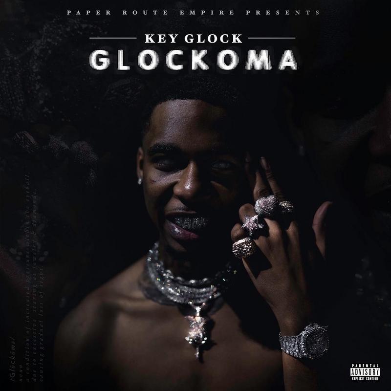 Key Glock: The Heir To The PRE Empire 15 A person holding a microphoneDescription automatically generated with medium confidence