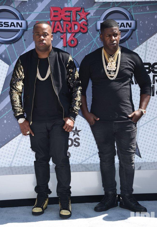 A picture containing text, person, posing, people

Description automatically generated