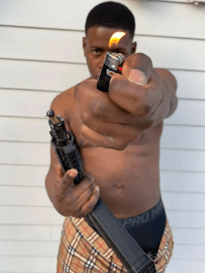 Key Glock: The Heir To The PRE Empire 25 A person holding an objectDescription automatically generated with low confidence