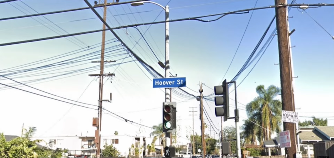 A street sign on a poleDescription automatically generated with medium confidence
