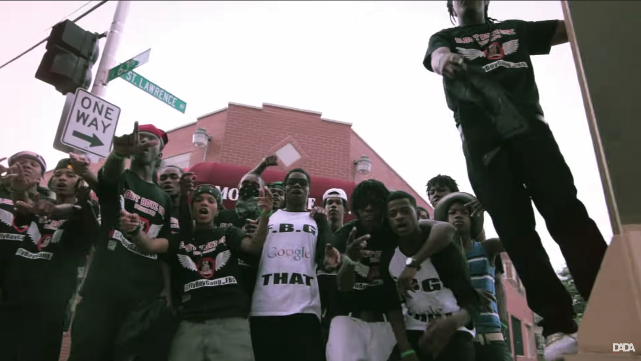 A group of people standing in front of a building

Description automatically generated with medium confidence