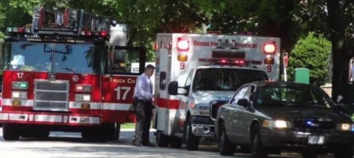 The Legacy Of T.Roy: The Chiraq Rambo 57 A person standing next to a car and a firetruck
Description automatically generated with low confidence