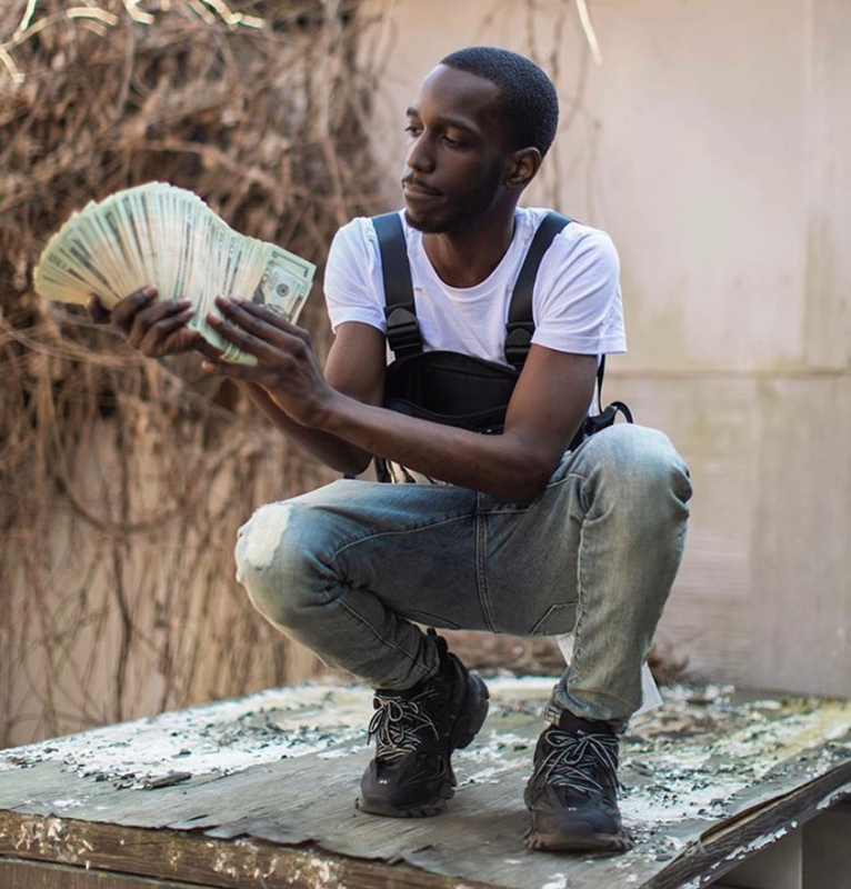 The Legacy Of T.Roy: The Chiraq Rambo 13 A picture containing person, outdoor
Description automatically generated