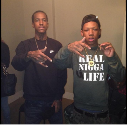 A group of people standing in front of a mirror posing for the camera

Description automatically generated