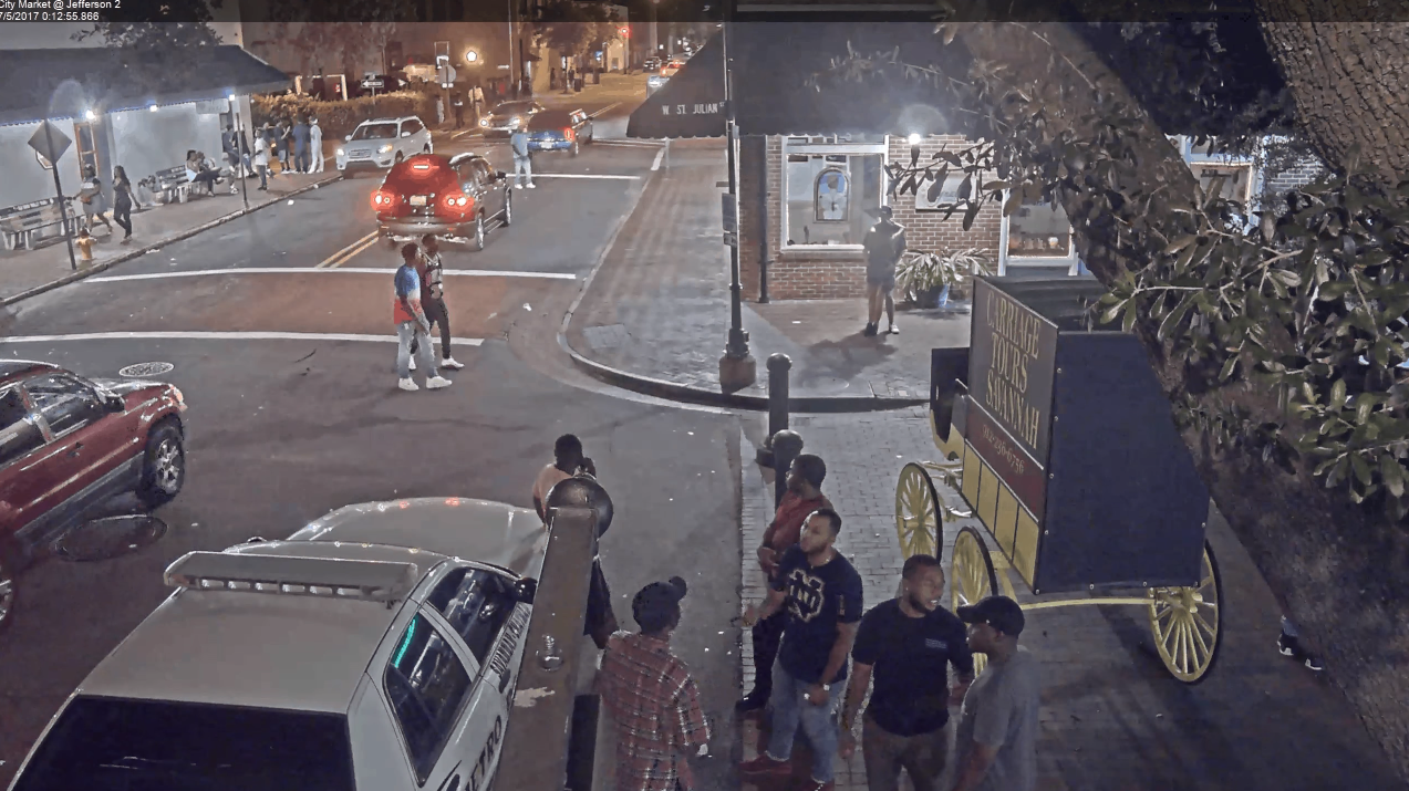 The Rise And Fall of Quando Rondo’s Gang “Only The Mob” 5 A group of people standing on a street
Description automatically generated