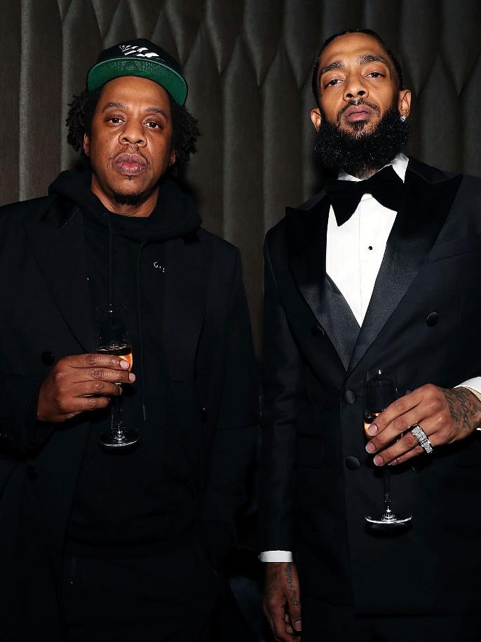 A couple of men posing for a pictureDescription automatically generated with low confidence