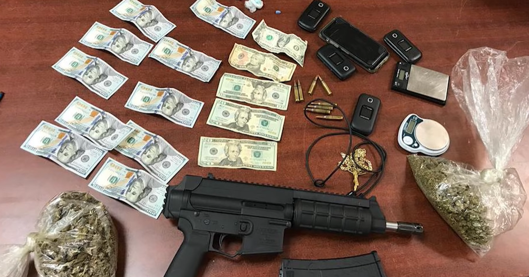A picture containing table, weapon, gun, indoor
Description automatically generated