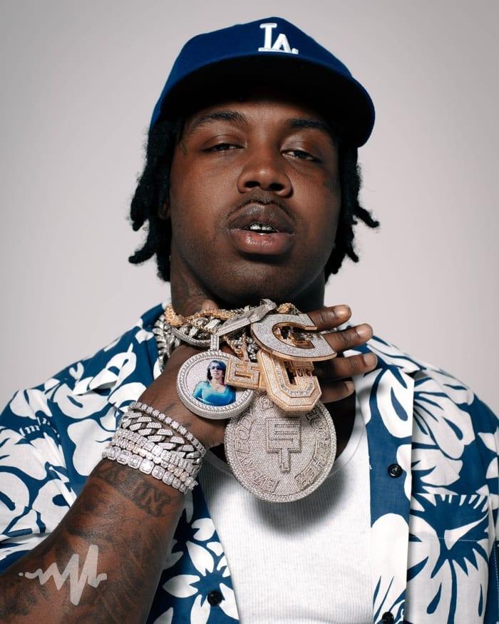 <strong>EST GEE: From Pro Athlete To Drug Kingpin To Rap Superstar</strong> 4 A person holding a snake
Description automatically generated with low confidence
