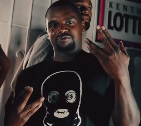 <strong>EST GEE: From Pro Athlete To Drug Kingpin To Rap Superstar</strong> 10 A person holding a game controller
Description automatically generated with low confidence