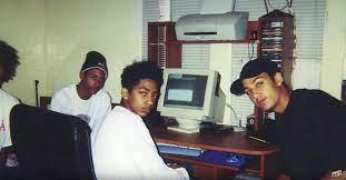 A group of men sitting at a deskDescription automatically generated with low confidence