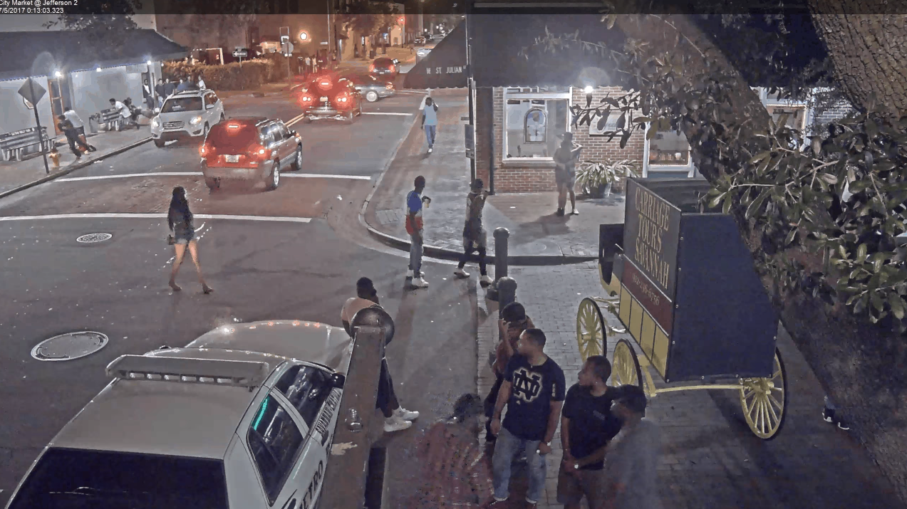 The Rise And Fall of Quando Rondo’s Gang “Only The Mob” 6 A group of people standing on a sidewalk
Description automatically generated